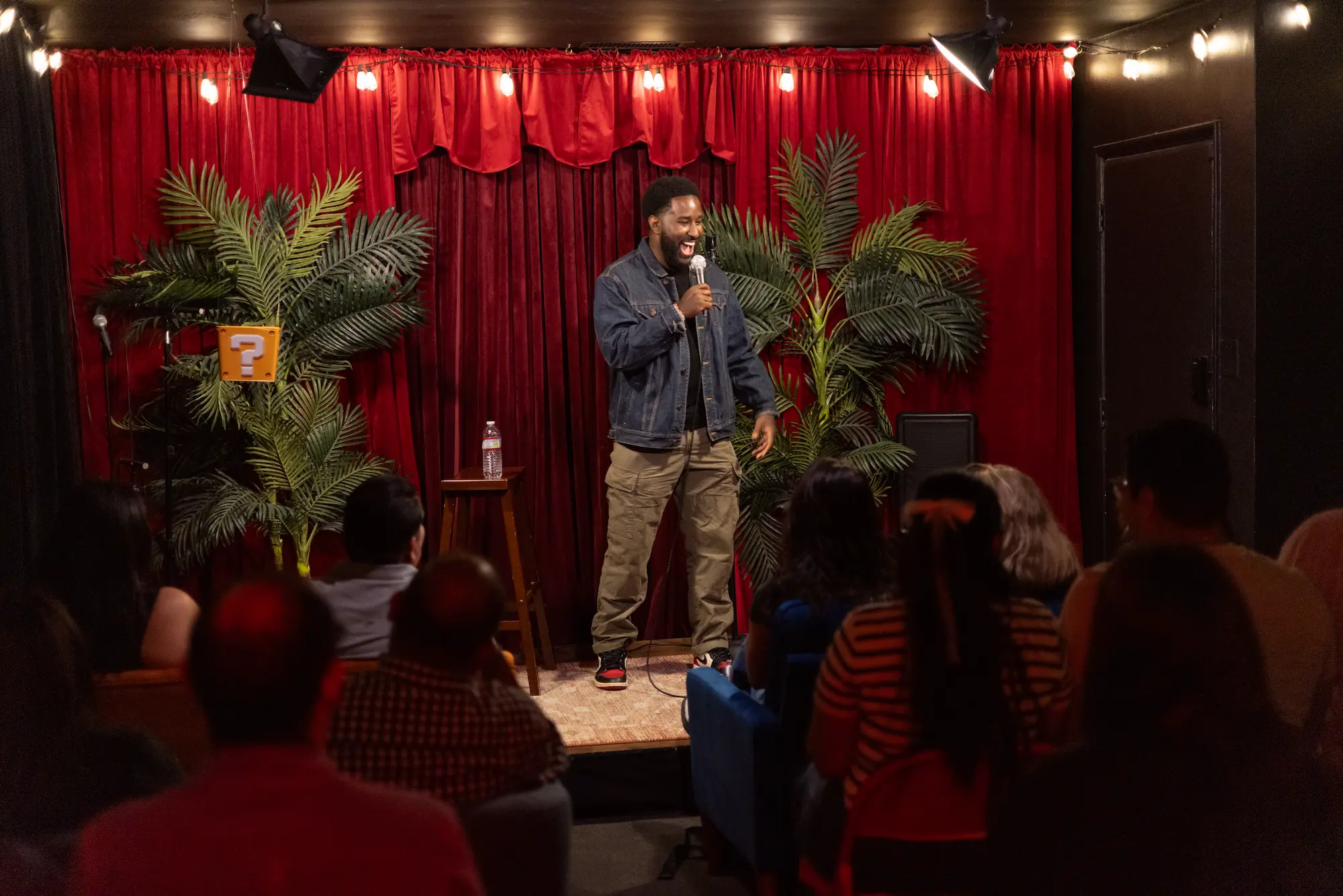 Herb performing standup at Badger and Jam